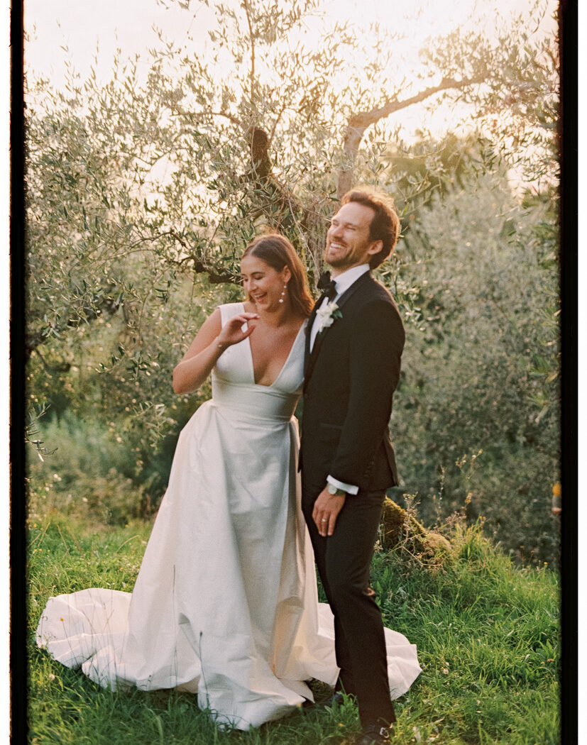casale-de-pasquinelli-wedding-frankie-and-marilia-71 spontaneous film photograph of couple during sunset standing in front of an ancient olive tree