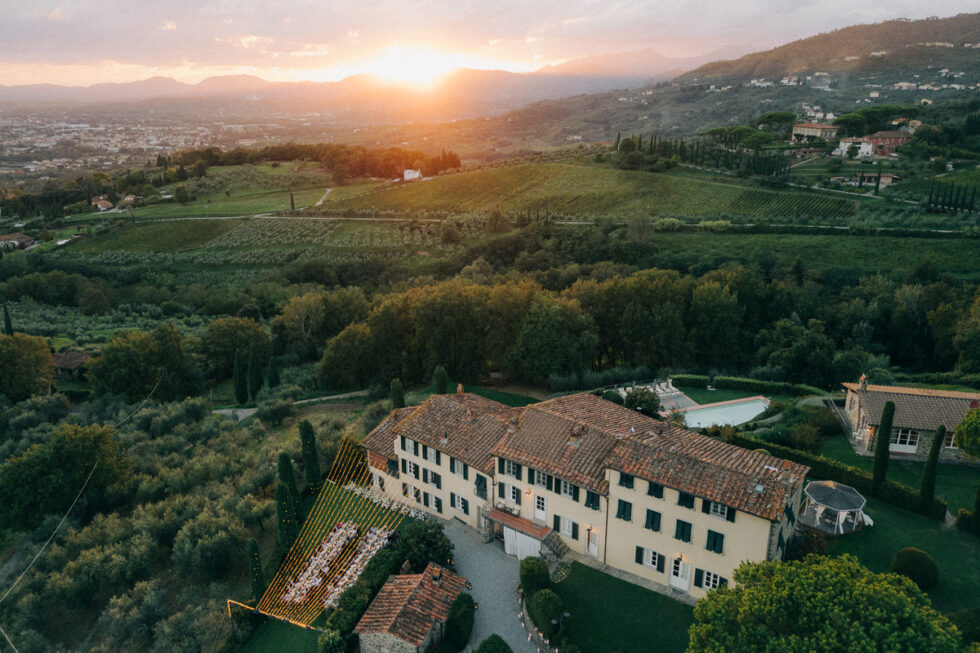 aerial view of the dinner area and sunset during a september wedding in tuscany